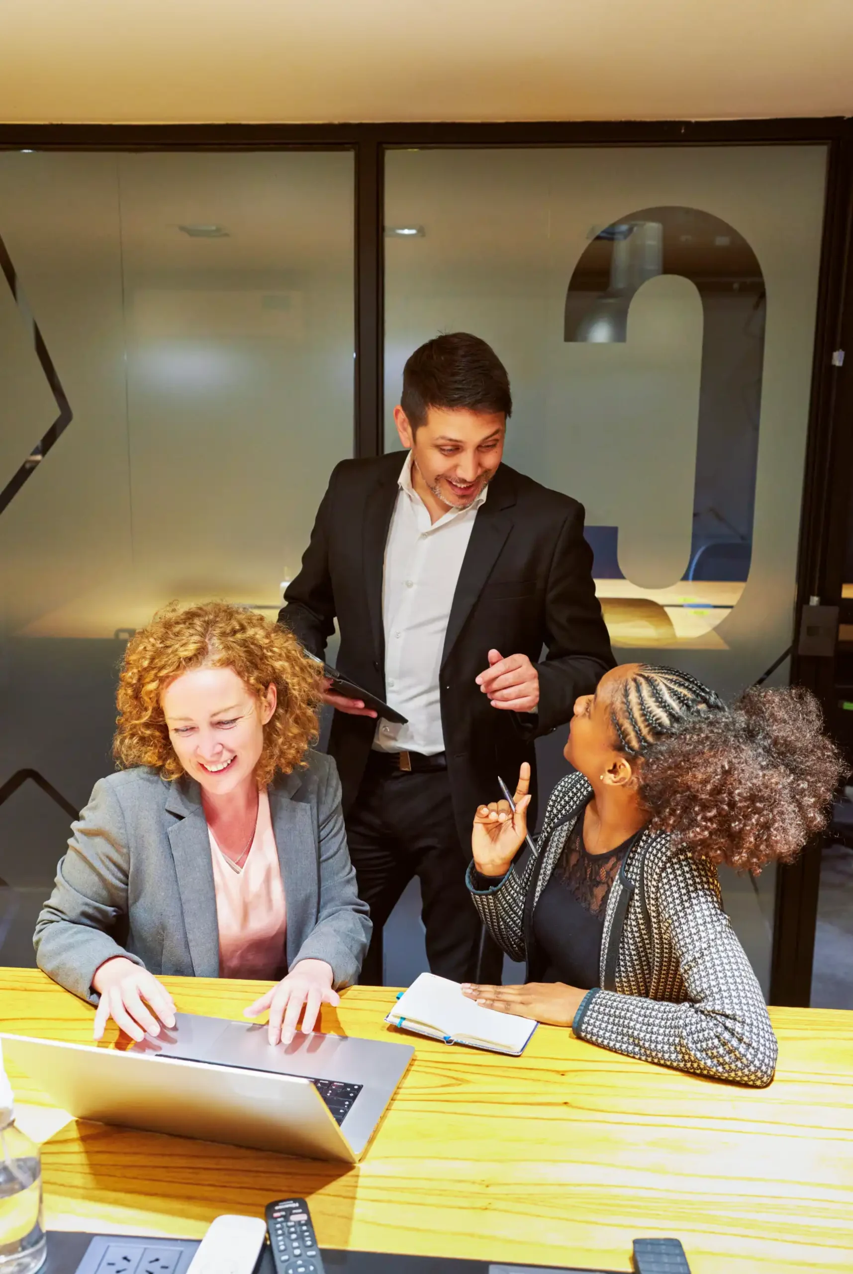 three-multiracial-business-people-working-in-an-of-2024-10-07-02-52-23-utc